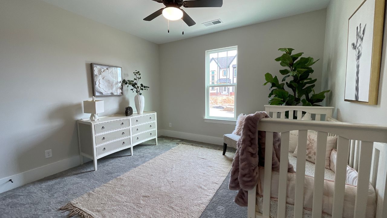 Entry-level bedroom staged as nursery