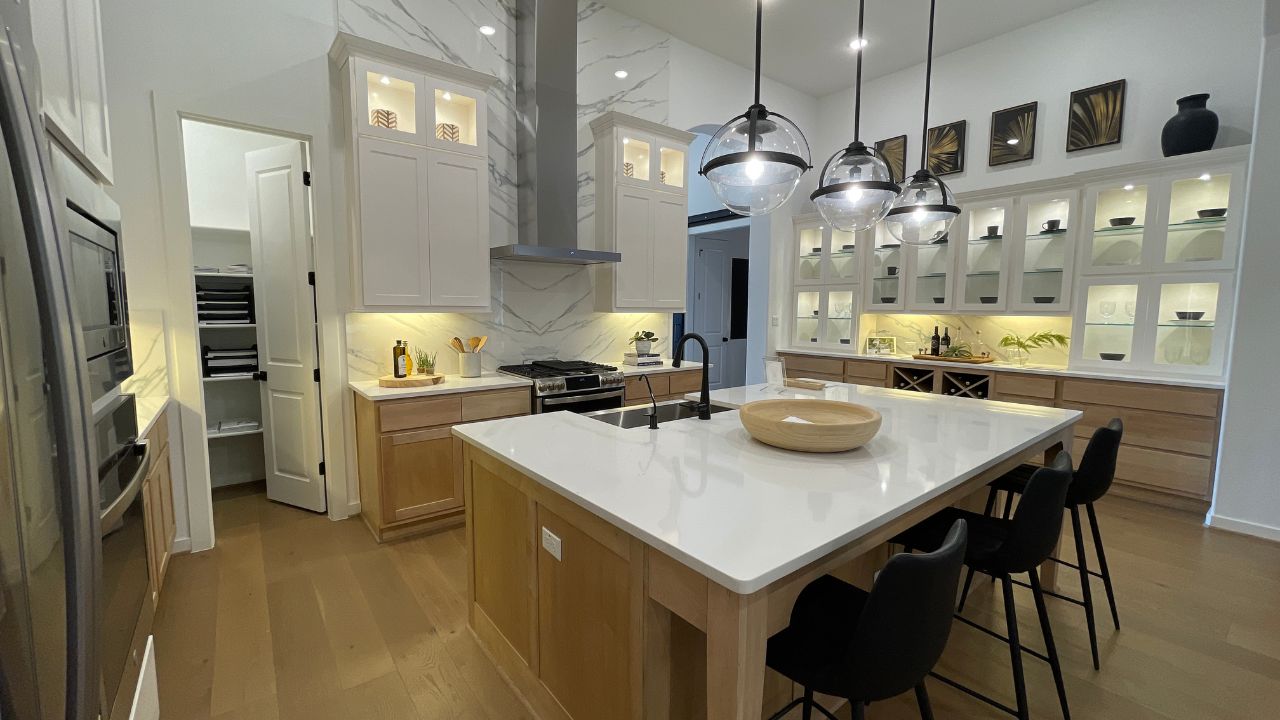 Gourmet kitchen in the 272 model by Highland homes