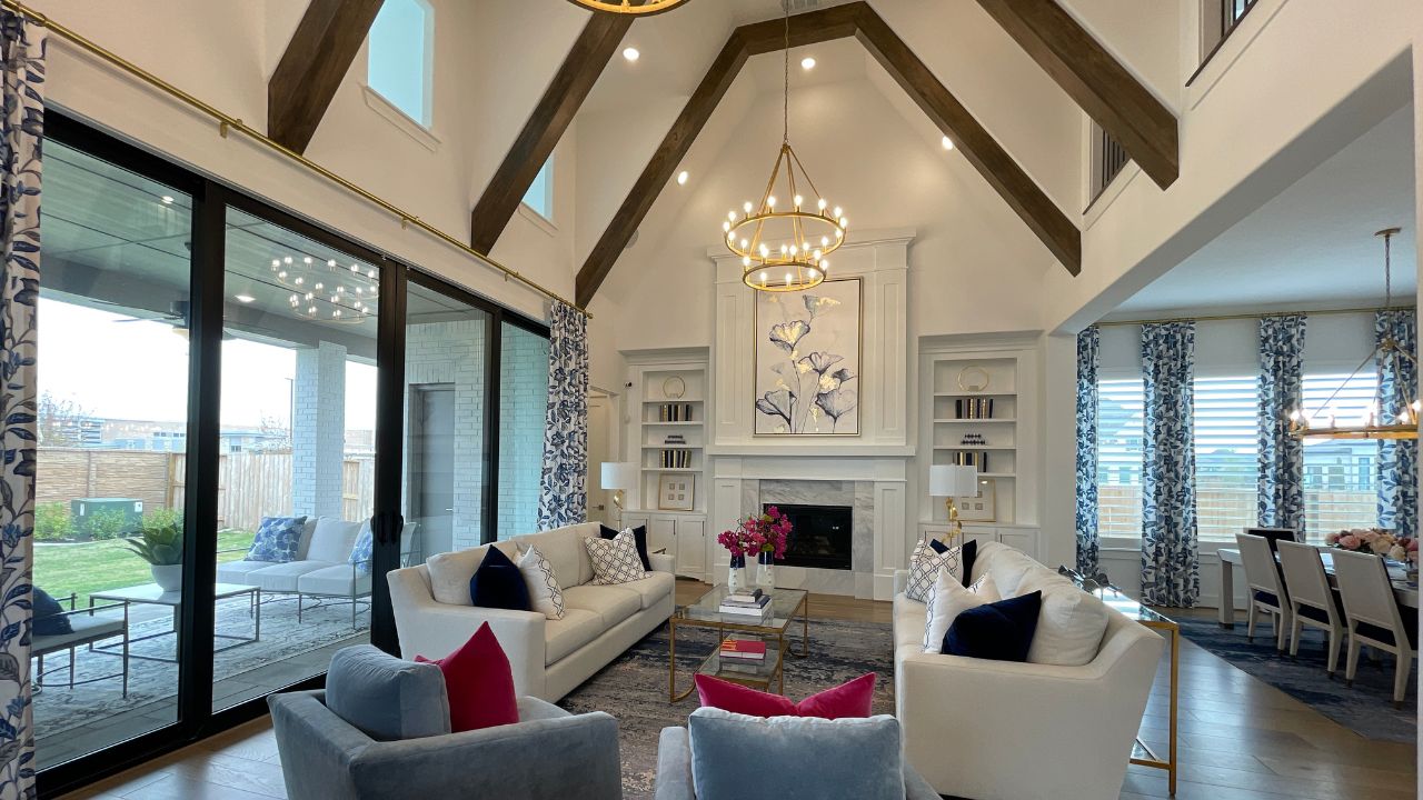 Living area with exposed beams and vaulted ceiling
