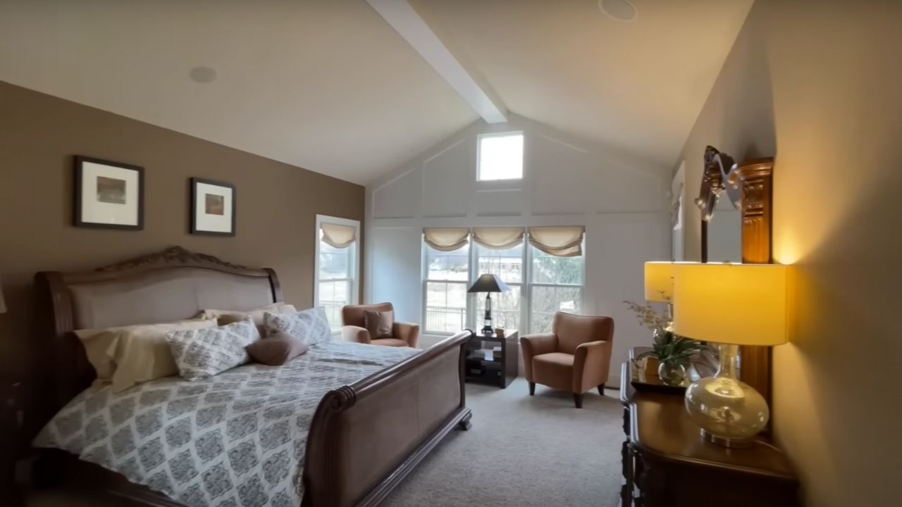 Entry-level primary bedroom by Schumacher Homes
