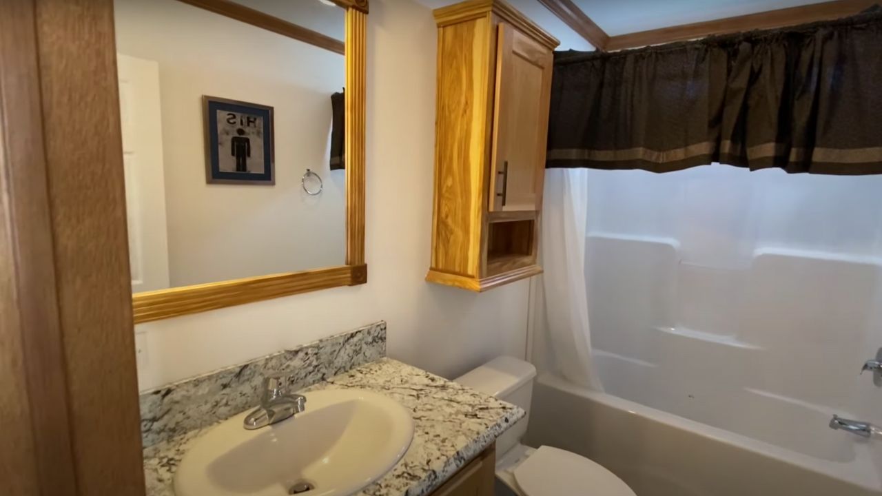Shared hall bathroom with hickory wood features