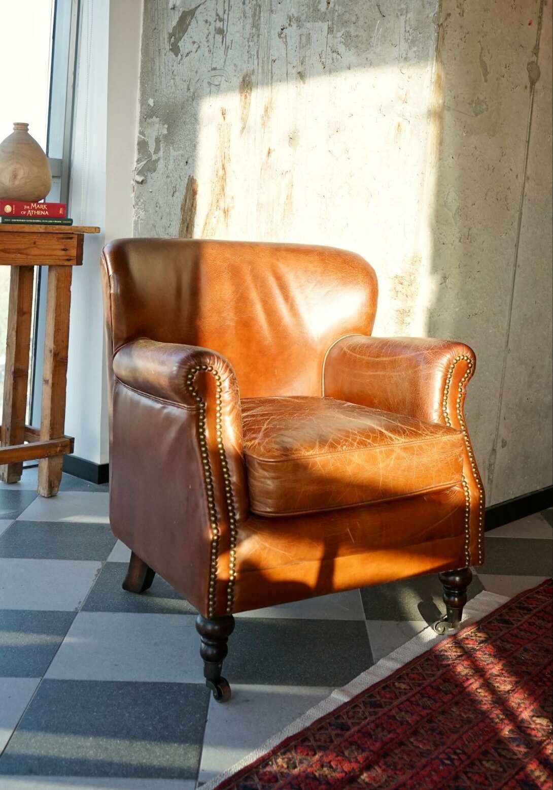Distressed leather armchair